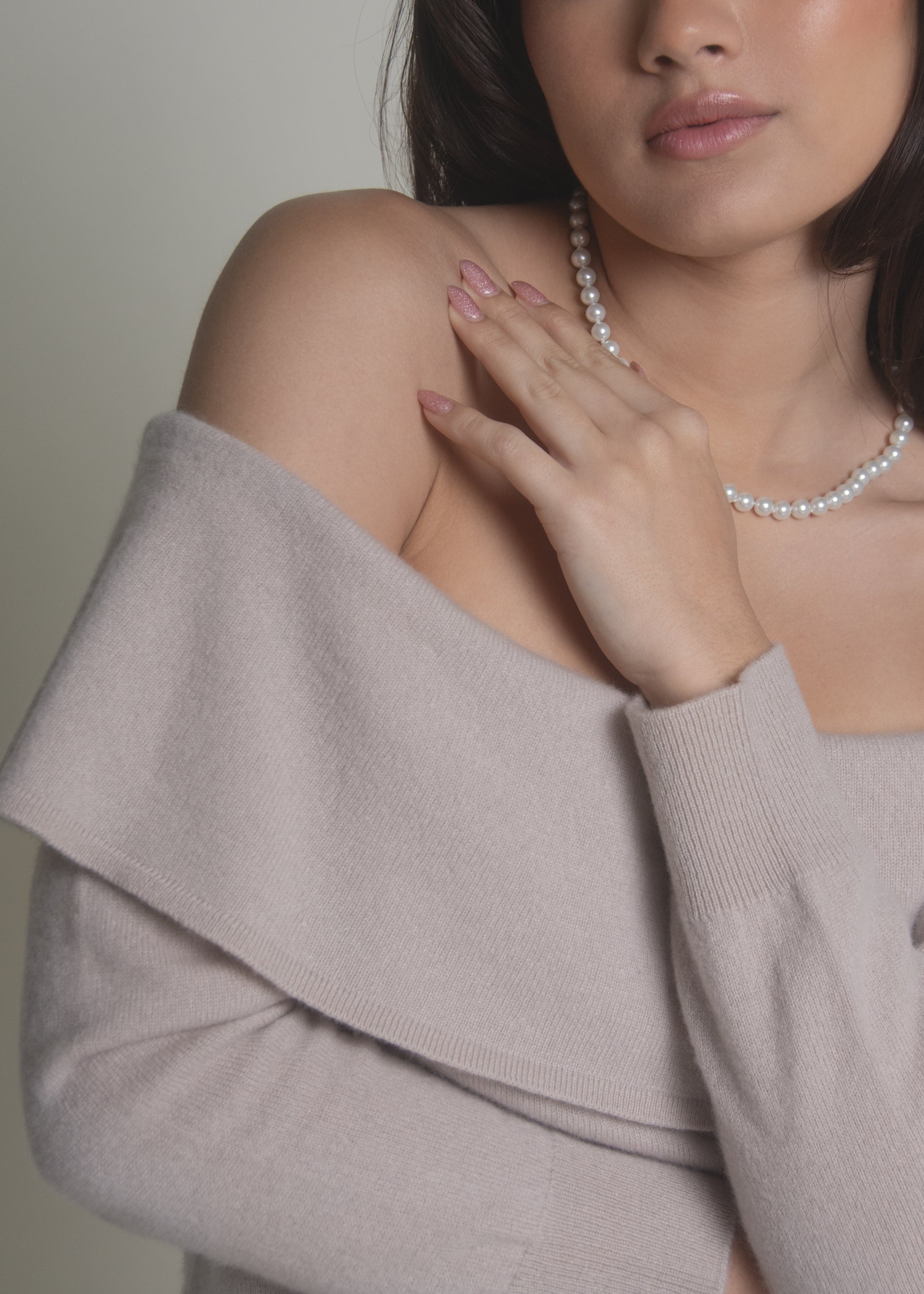 close-up of beige off-shoulder cashmere sweater bardot neckline