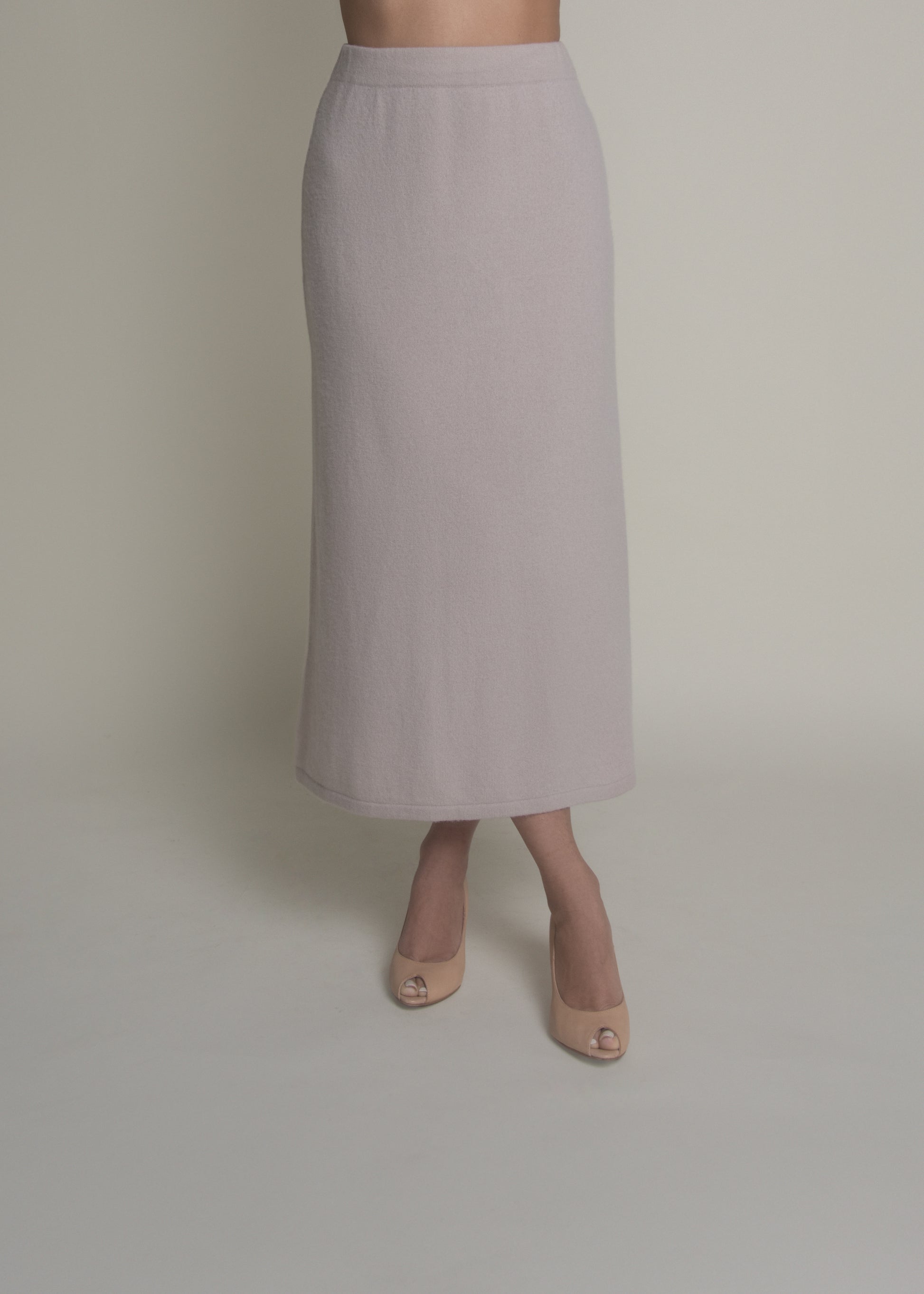 woman wearing beige a-line cashmere skirt front view