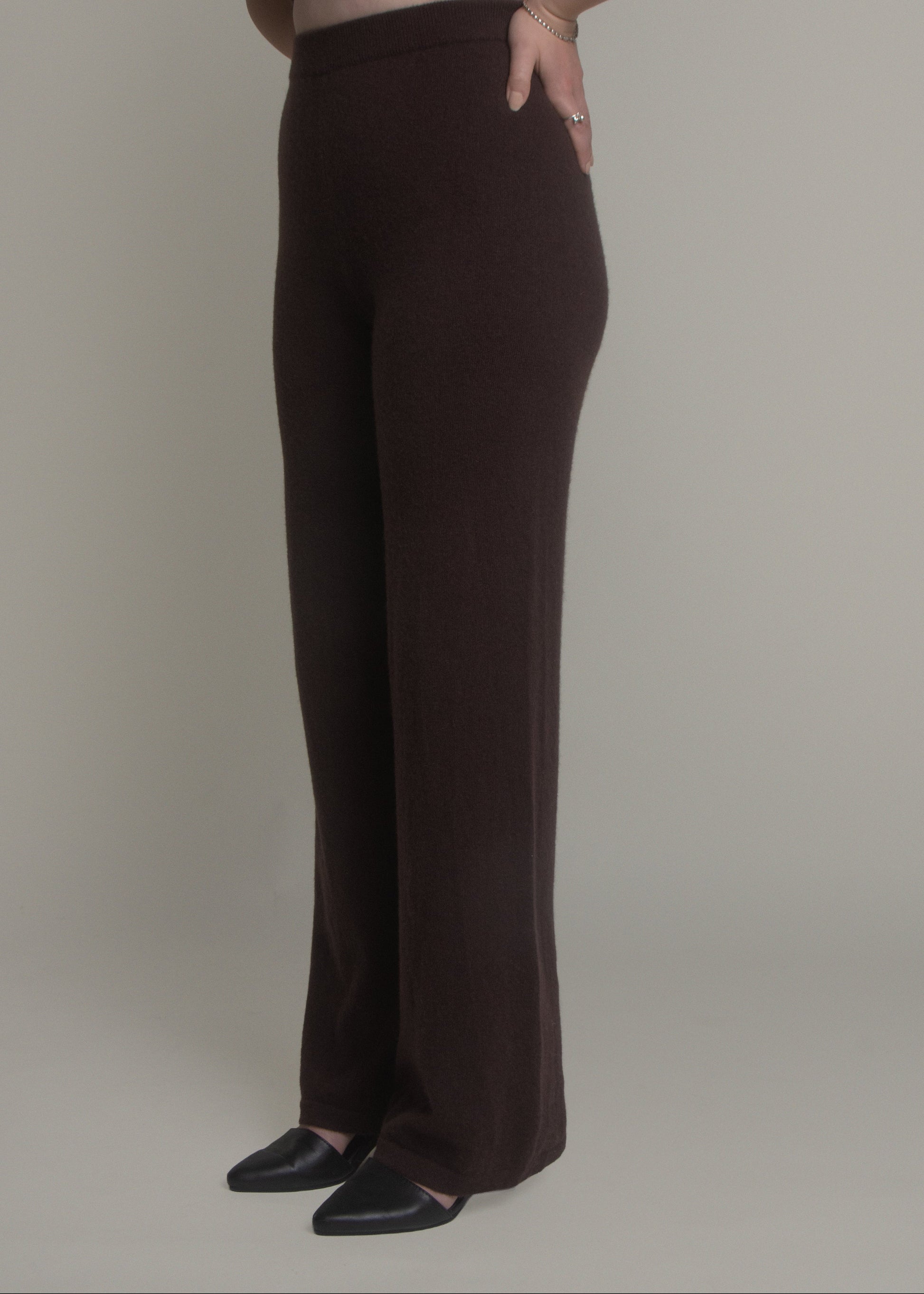 woman wearing dark wide leg cashmere pants front view