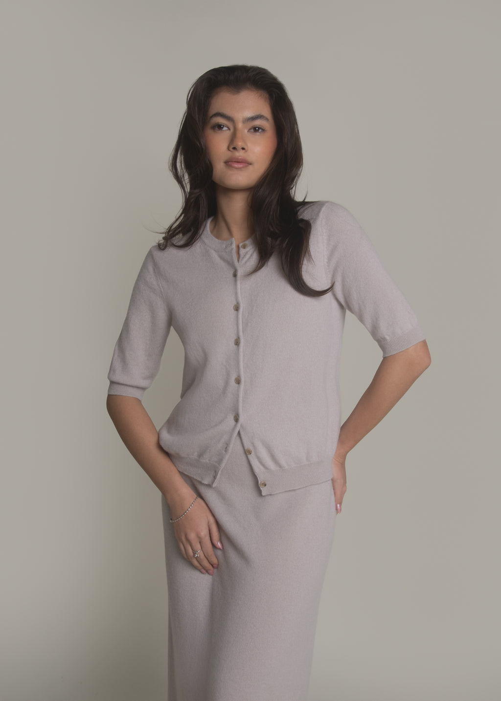 woman wearing short sleeve cashmere cardigan front view