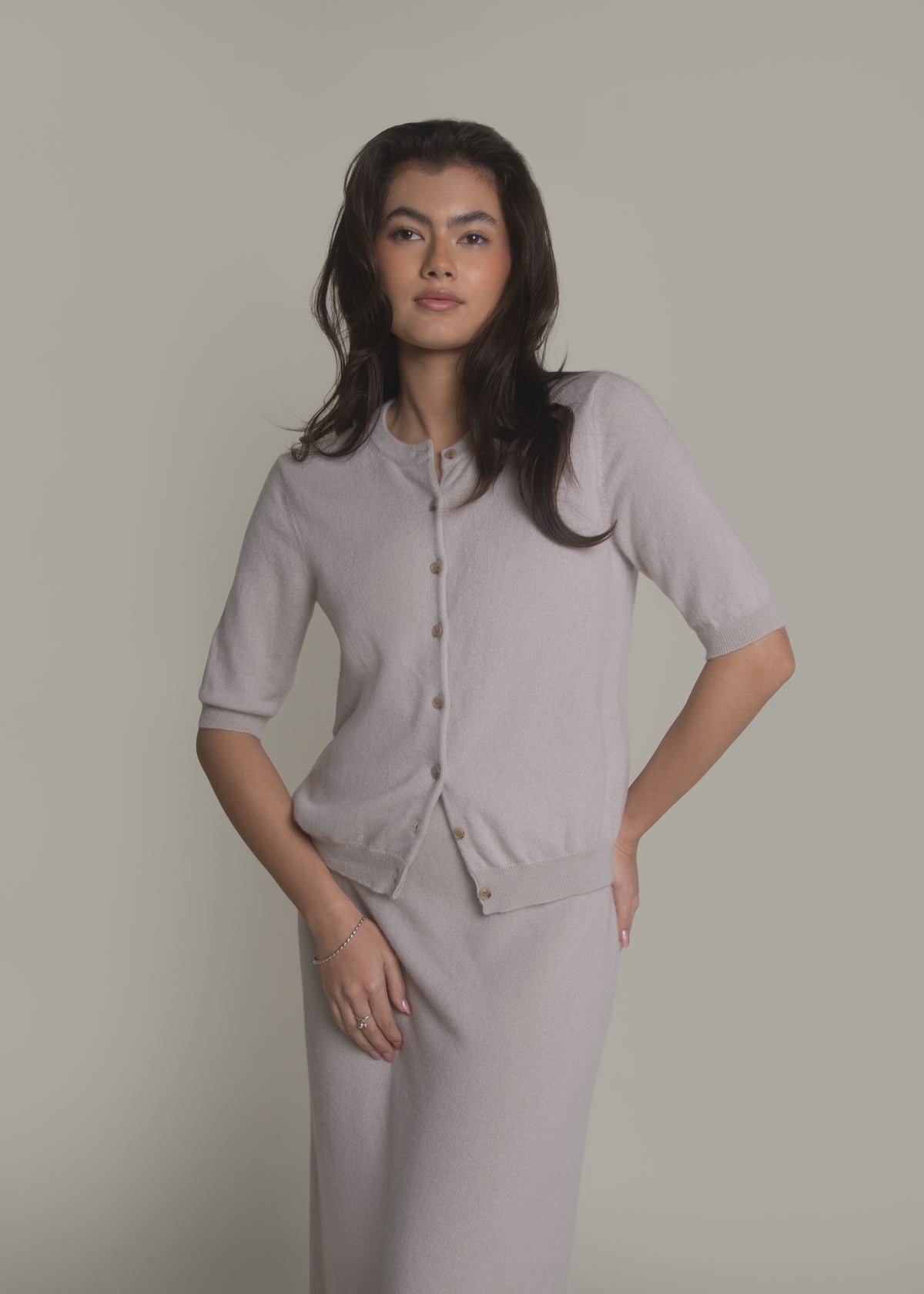 woman wearing short sleeve cashmere cardigan front view