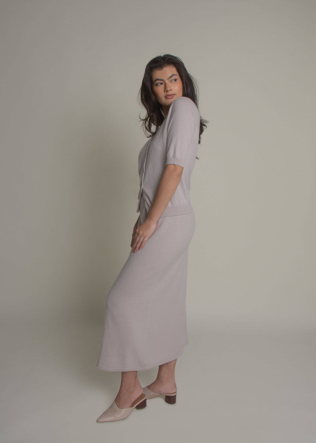 beige a-line cashmere skirt styled with matching knit top