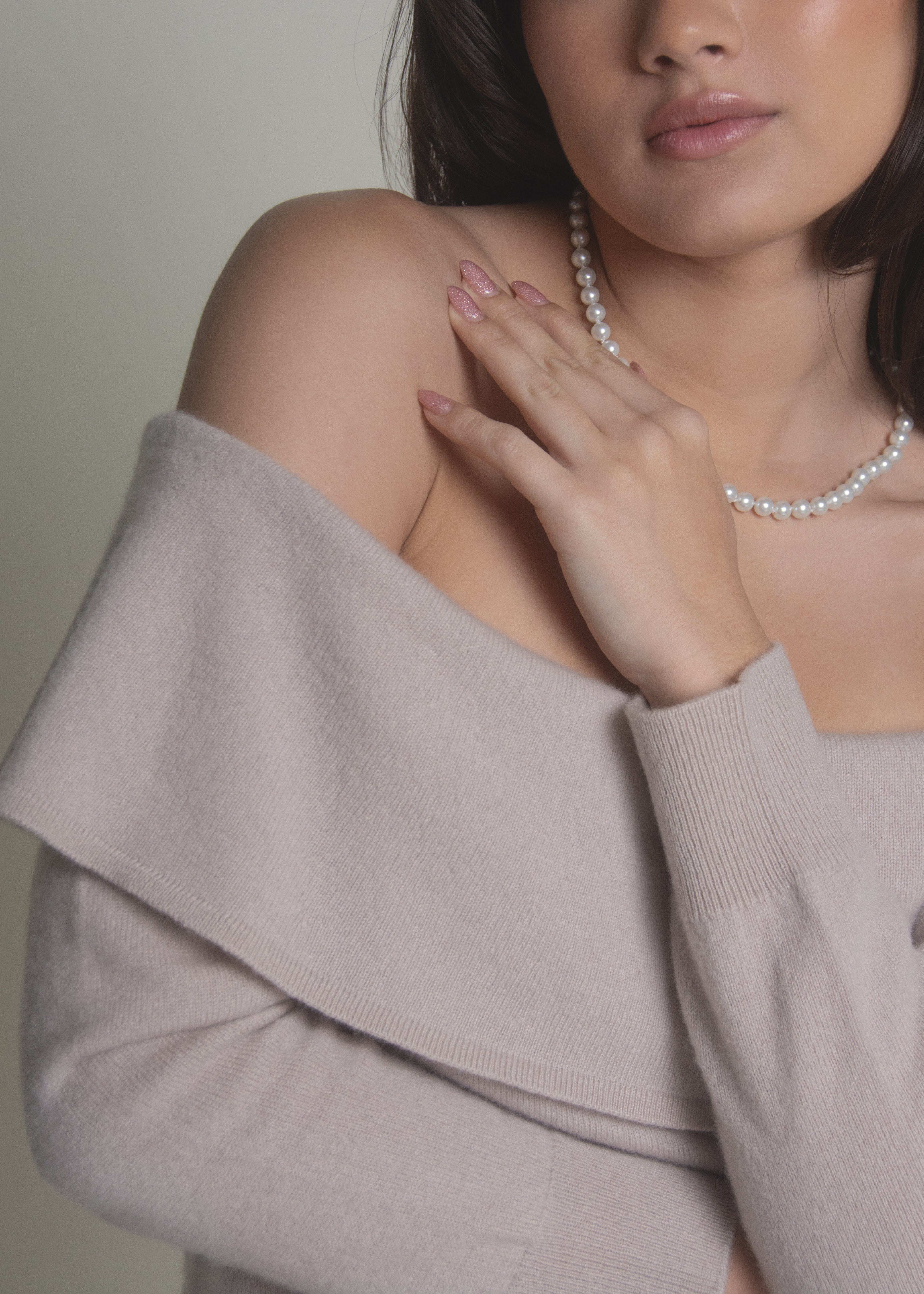 close-up of beige off-shoulder cashmere sweater bardot neckline