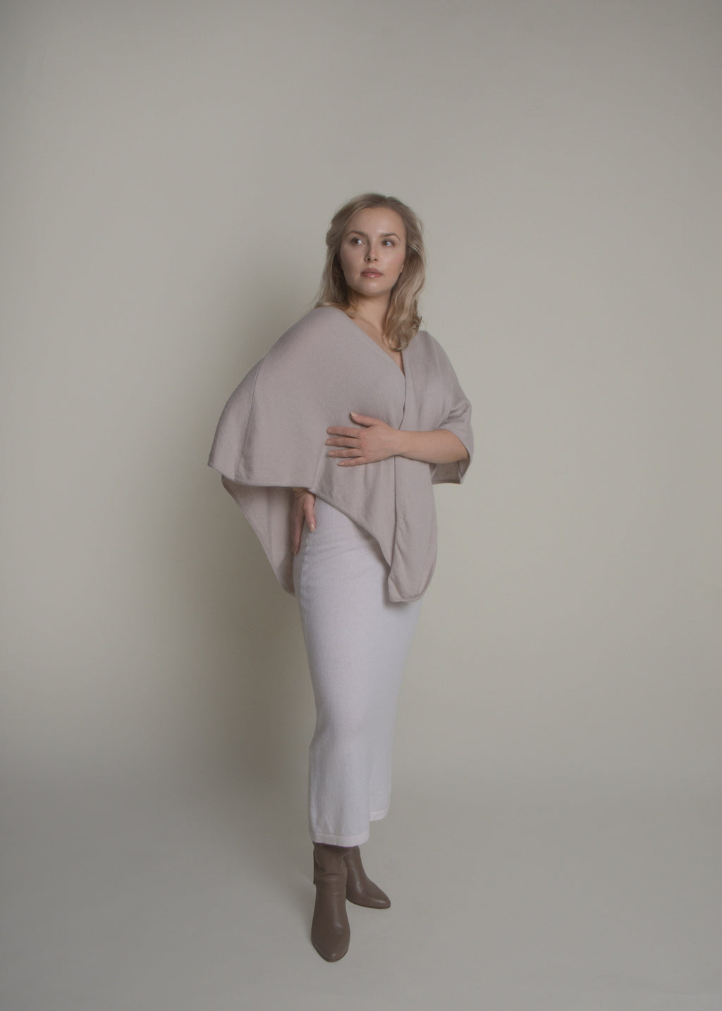 side view of open front cashmere poncho draped over shoulders