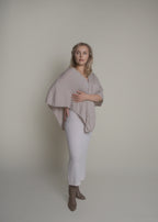 side view of open front cashmere poncho draped over shoulders