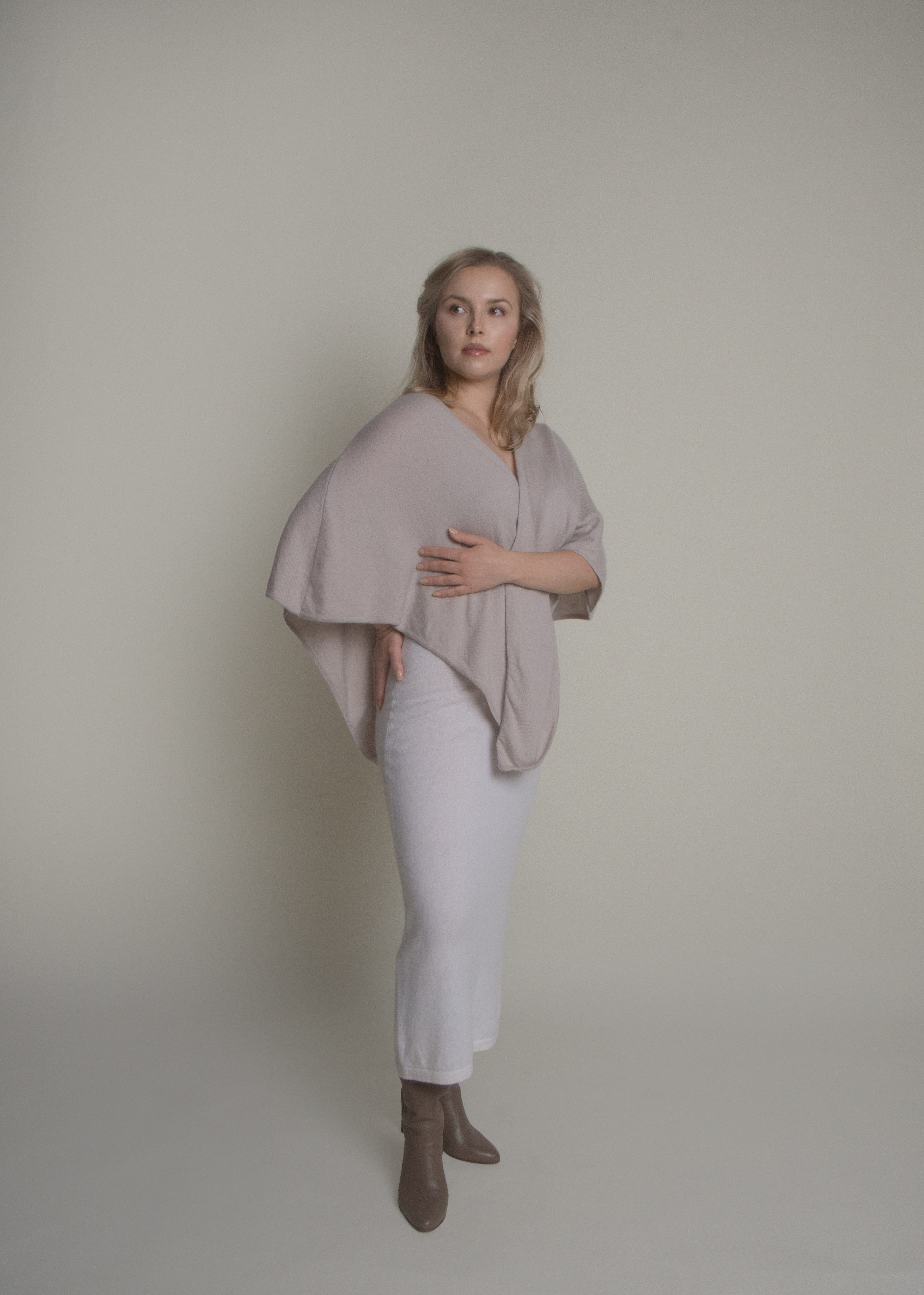 side view of open front cashmere poncho draped over shoulders