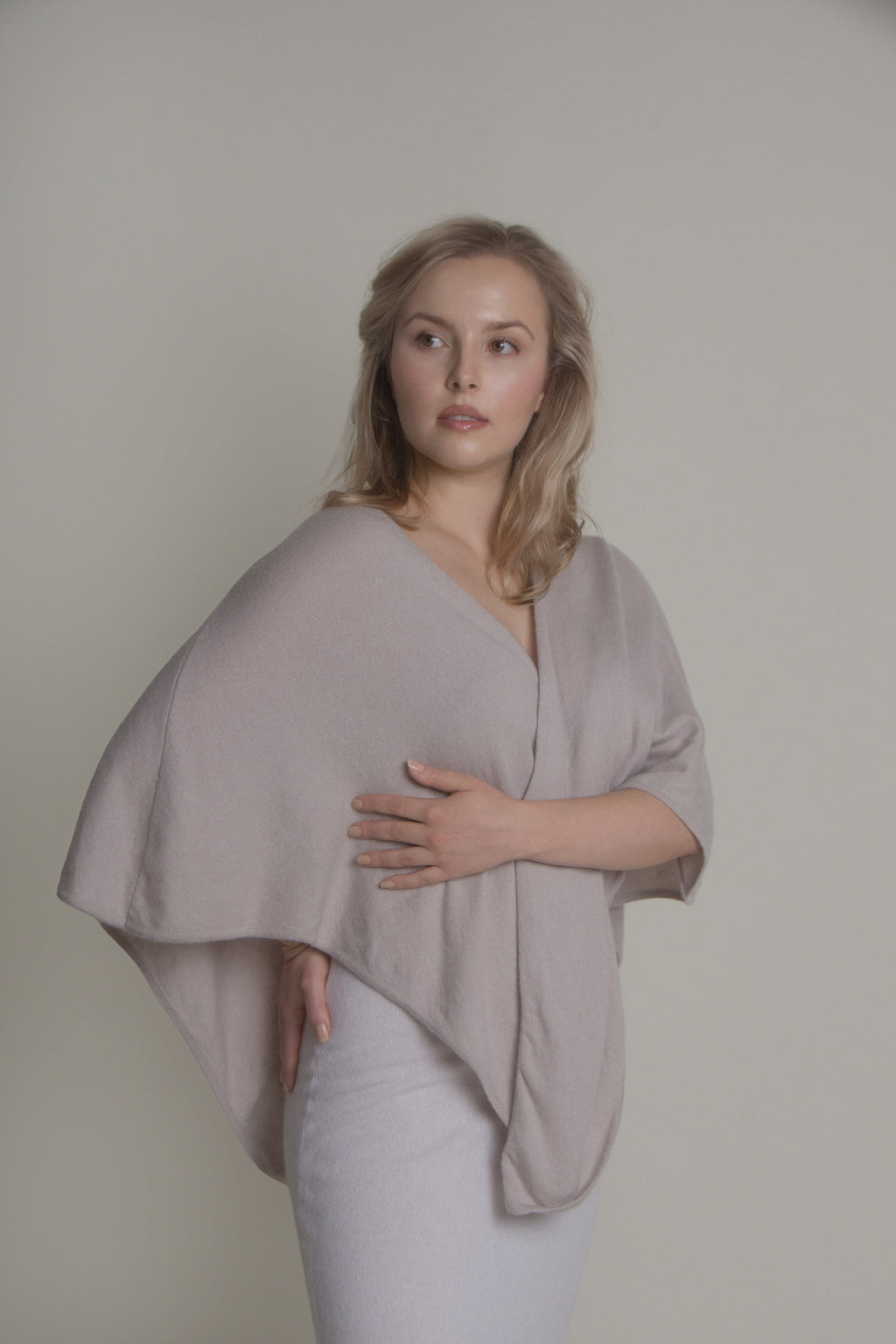 woman wearing light open front cashmere poncho front view