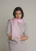 woman wearing pink ultralight cashmere shawl wrapped around neck
