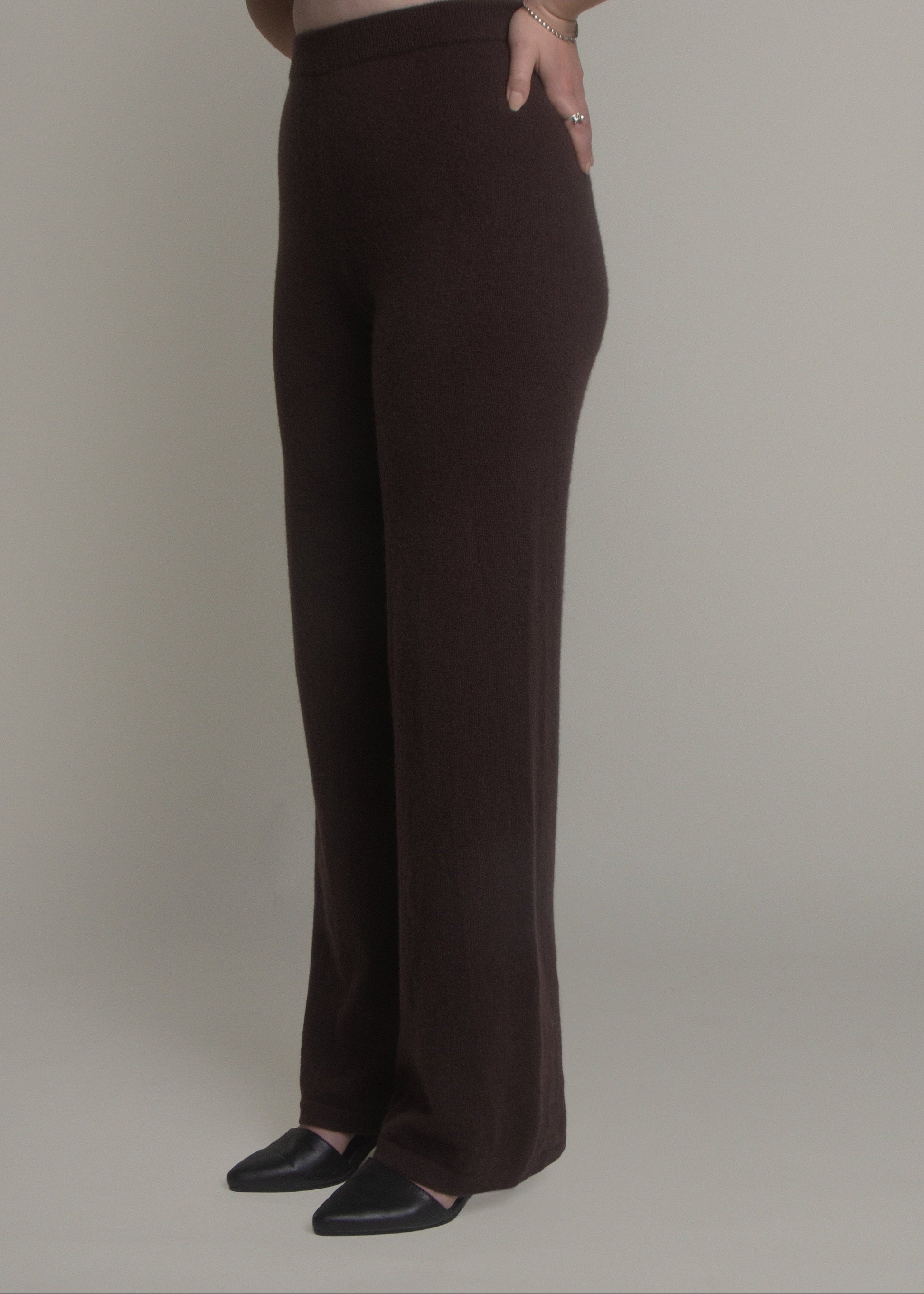 woman wearing dark wide leg cashmere pants front view