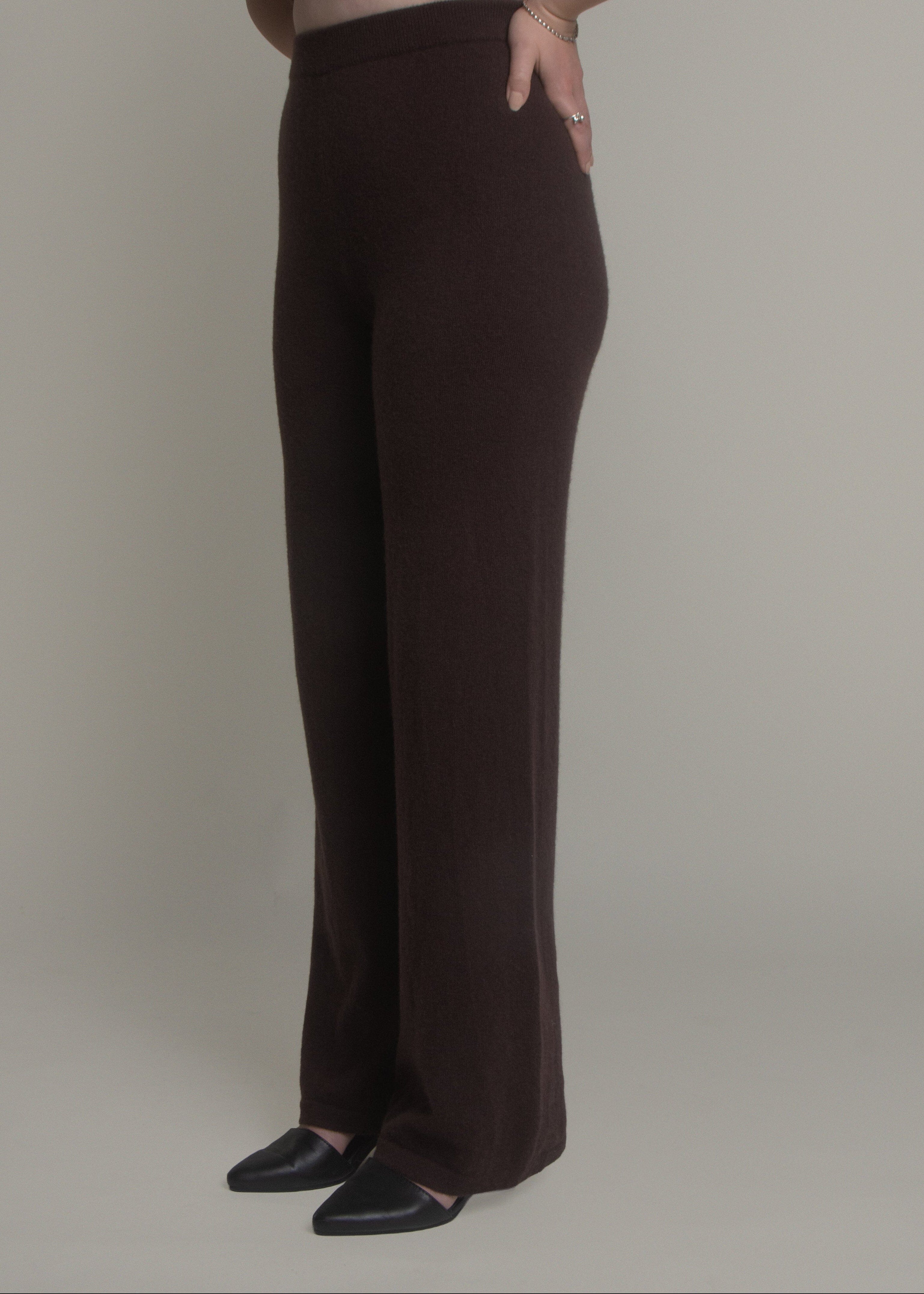 woman wearing dark wide leg cashmere pants front view